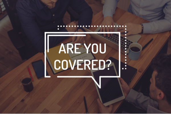 3 people working at a table with a "are you covered?" graphic