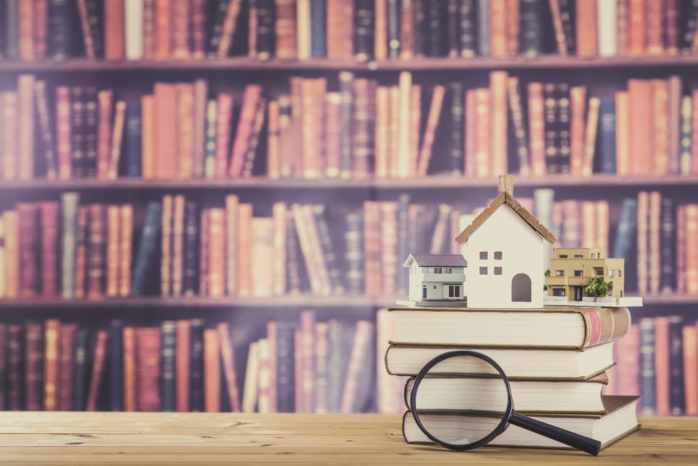 model house on top of books