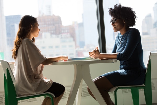 two women communicating professionally 