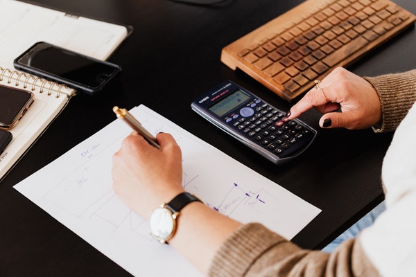 person using a calculator